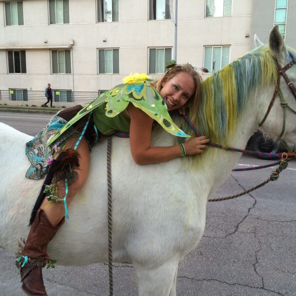 Halloween fairy poses with real life unicorn in ATX for Austin festival